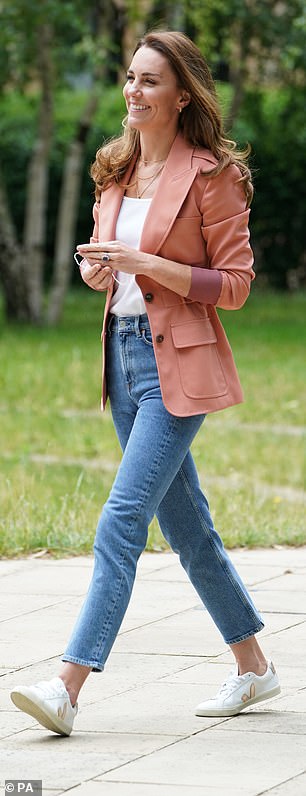 She frequently elevates casual outfits by pairing a blazer with mom jeans and trainers - a go-to combination she's showcased time and again