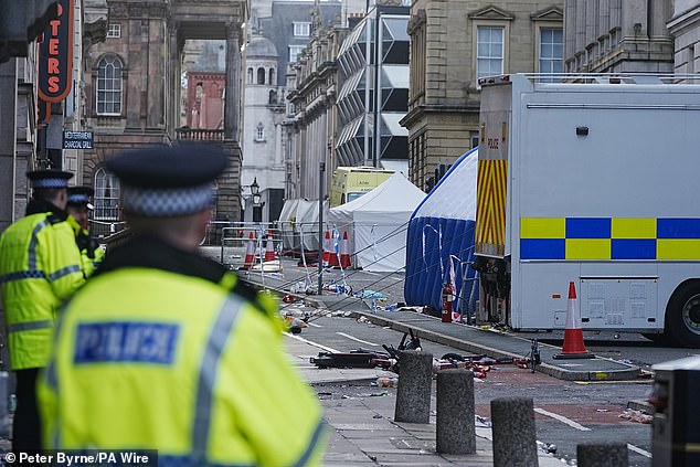 Police tents surrounded by debris at the scene in Water Street the morning after the horror