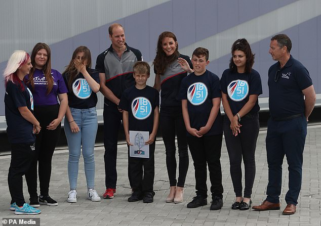 Zak Kay with his winning design between the then Duke and Duchess of Cambridge at the Land Rover BAR team base during a visit to Portsmouth to see the America´s Cup World Series (PA) in 2016