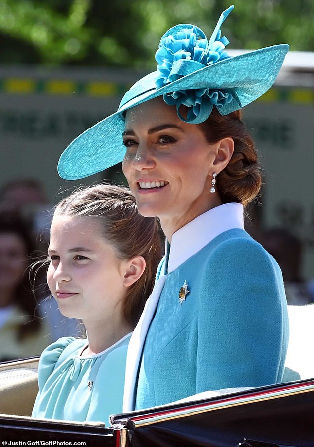 Charlotte took after her mother as they wore matching blue dresses, with Kate picking a blue coat dress from Catherine Walker for Trooping the Colour last week