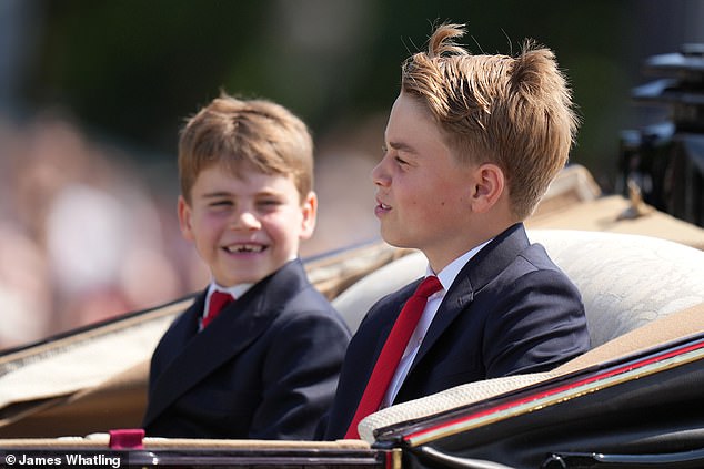 Prince Louis and Prince George smile as they enjoy the large-scale parade on a sunny Saturday in London