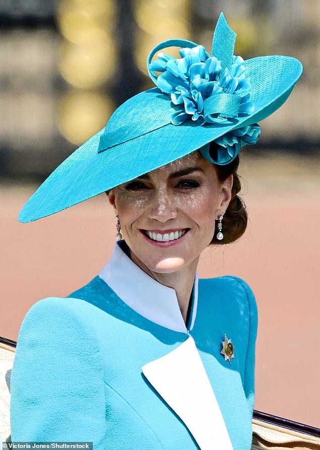 The Princess of Wales bears a radiant smile as she accompanies her children during the parade today