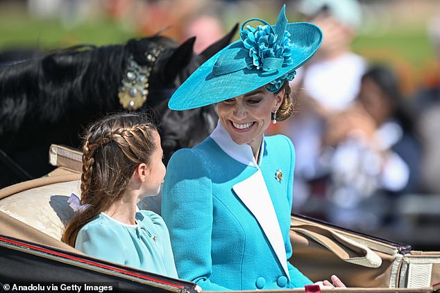 Mother and daughter appeared to be enjoying today's parade as they smiled and talked animatedly