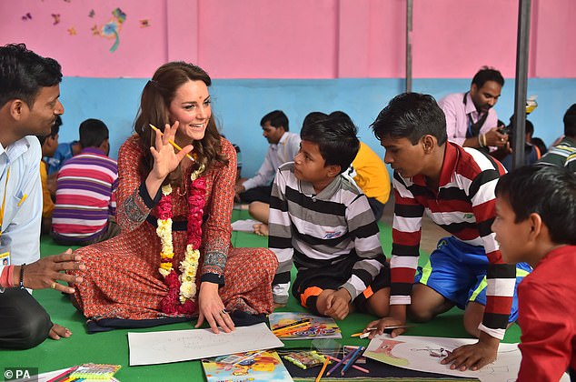 The Princess of Wales meets children at the Salaam Baalak Trust centre in New Delhi railway station in India, where the charity provides food, education and healthcare to the needy