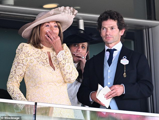 Carole Middleton, dressed in Me+Em's £325 Two Tone Lace-Blend Midi Dress, and Sam Waley-Cohen watching the Queen Mary Stakes on day two of Royal Ascot