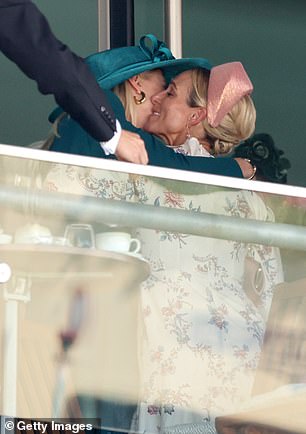 Lady Gabriella Windsor and Zara Tindall hug as they attend day two of Royal Ascot