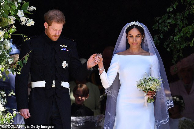 The Duke and Duchess of Sussex emerge from St George Chapel in Windsor Castle after their wedding ceremony. The couple announced their engagement in November 2017 and were married on May 19, 2018