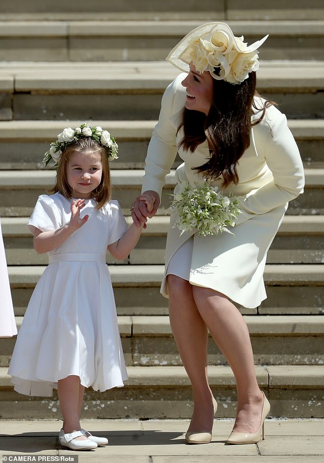 The Duchess of Cambridge and Princess Charlotte on Harry and Meghan's wedding day in 2018. A newspaper report six months later suggested Meghan made Kate cry after they clashed over the wearing of tights with the bridesmaids’ dresses