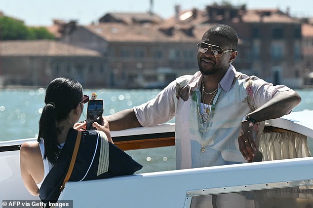 It seems as though Usher had his own personal photographer as Jennifer was pictured taking snaps of him while on a gondola