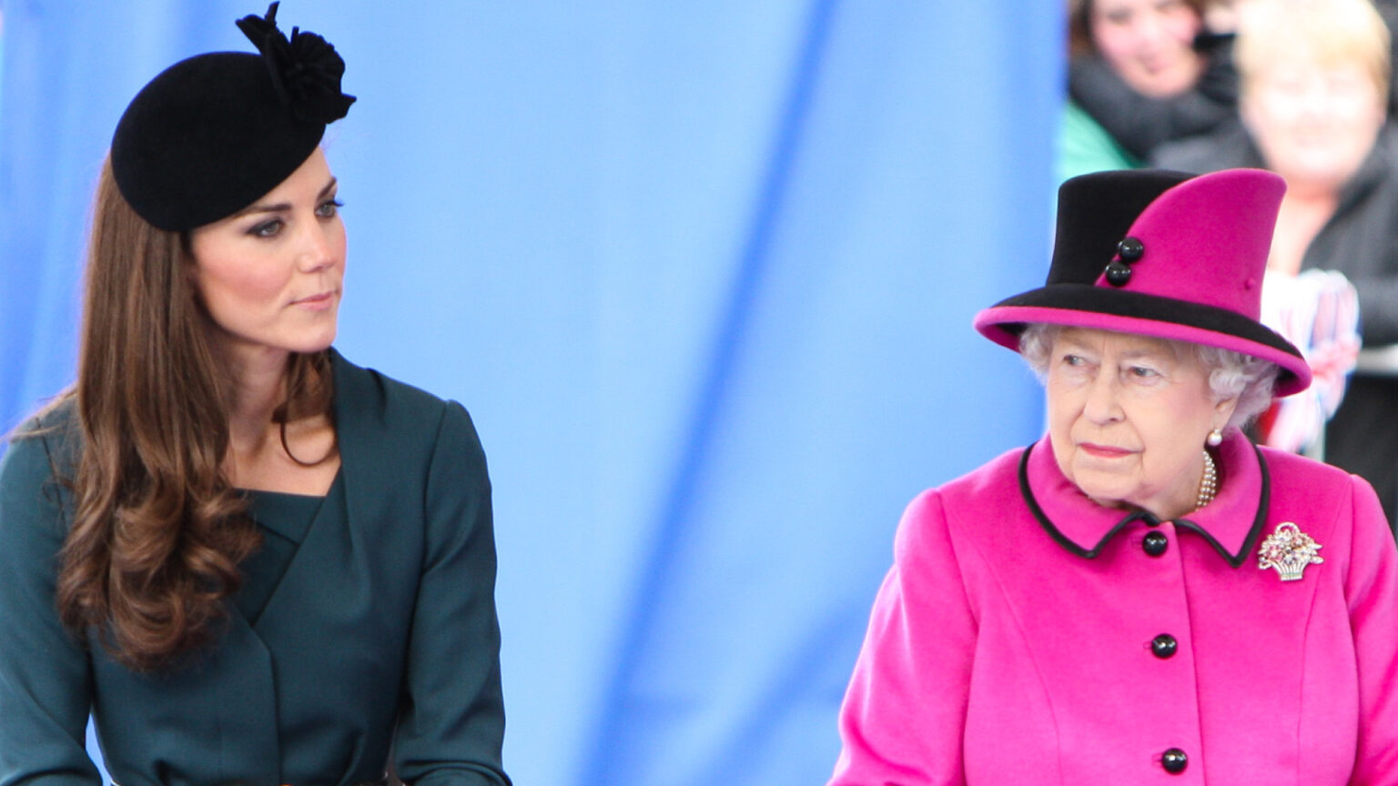 Queen Elizabeth Allegedly Had Concerns About Kate Middleton Kate Middleton wears a dark green dress with a black hat and Queen Elizabeth wears a bright pink coat