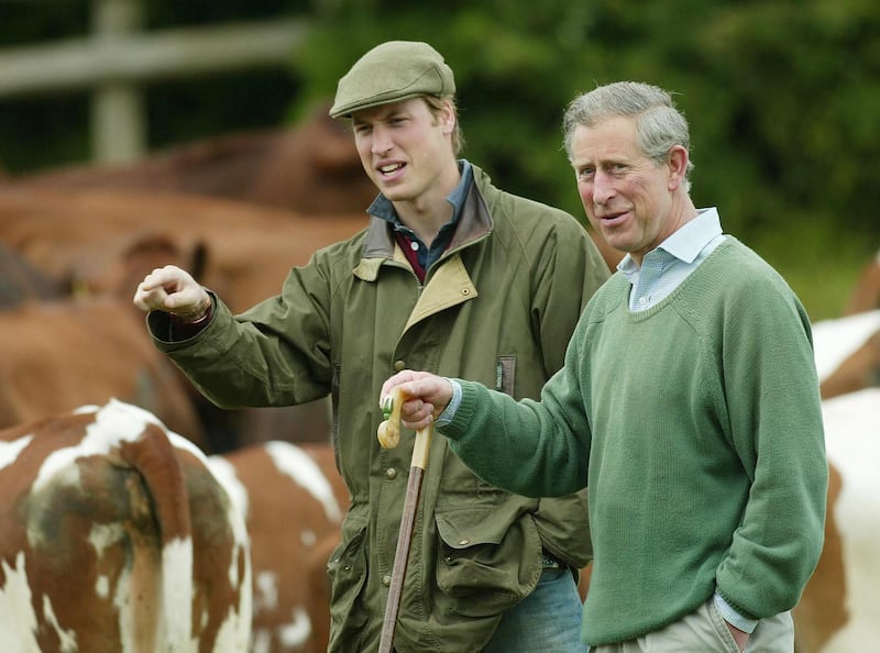 William with his father, then-the Prince of Wales during a visit to Duchy Home Farm in Gloucestershire in 2004