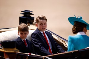 (L-R) Britain's Prince Louis of Wales, Britain's Prince George of Wales and Britain's Catherine, Princess of Wales, make their way back to Buckingham Palace from Horse Guards Parade during the King's Birthday Parade, "Trooping the Colour", in London on June 14, 2025. The ceremony of Trooping the Colour is believed to have first been performed during the reign of King Charles II. Since 1748, the Trooping of the Colour has marked the official birthday of the British Sovereign. Over 1500 parading soldiers and almost 300 horses take part in the event. (Photo by BENJAMIN CREMEL / AFP) (Photo by BENJAMIN CREMEL/AFP via Getty Images)