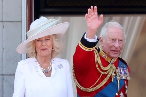 LONDON, ENGLAND - JUNE 14: Queen Camilla and King Charles III wave from the balcony at Buckingham Palace during Trooping The Colour 2025 on June 14, 2025 in London, England. Trooping The Colour is a ceremonial parade celebrating the official birthday of the British Monarch. The event features over 1,400 soldiers and officers, accompanied by 200 horses. More than 400 musicians from ten different bands and Corps of Drums march while performing. (Photo by Chris Jackson/Getty Images)