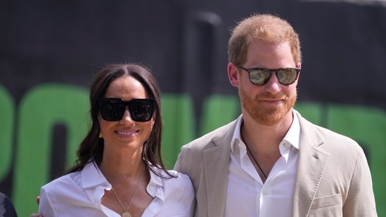 Prince Harry, right, and Meghan, left, have been facing invitations snub from the British monarch since they quit their Royal duties in 2020 and relocated to the US.(AP)