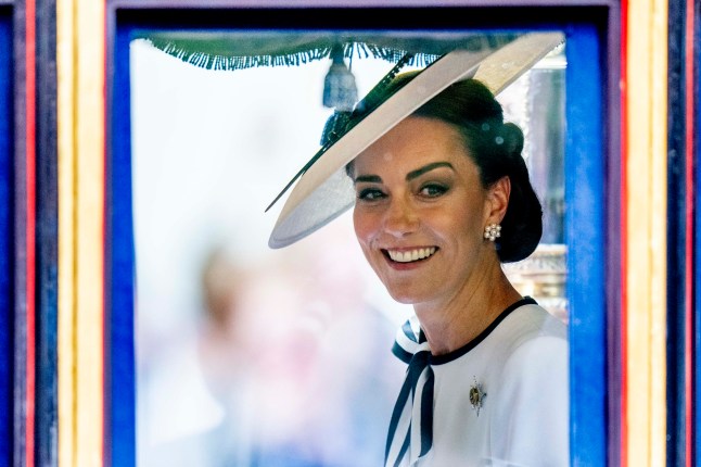LONDON, ENGLAND - JUNE 15: Catherine, Princess of Wales smiles during Trooping the Colour on June 15, 2024 in London, England. Trooping the Colour is a ceremonial parade celebrating the official birthday of the British Monarch. The event features over 1,400 soldiers and officers, accompanied by 200 horses. More than 400 musicians from ten different bands and Corps of Drums march and perform in perfect harmony. (Photo by Mark Cuthbert/UK Press via Getty Images)