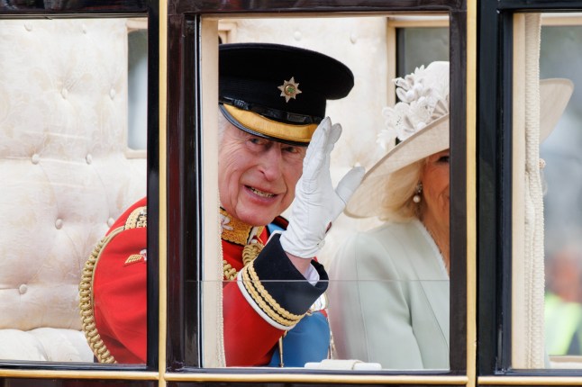 epa11411673 Britain's King Charles III (L) and Queen Camilla (R) travel from Buckingham Palace to Horse Guards Parade inside a carriage during the Trooping the Colour parade in London, Britain, 15 June 2024. The king's birthday parade, traditionally known as Trooping the Colour, is a ceremonial military parade to celebrate the official birthday of the British sovereign. EPA/TOLGA AKMEN