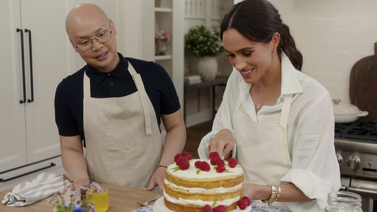 This image released by Netflix shows Daniel Martin, left, and Meghan, Duchess of Sussex, in a scene from "With Love, Meghan." (Netflix via AP)(AP)