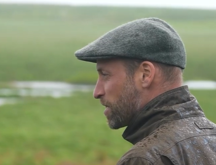 Prince William does flatcap chic Prince William wears a traditional flatcap with a waterproof coat on a visit to Dartmoor