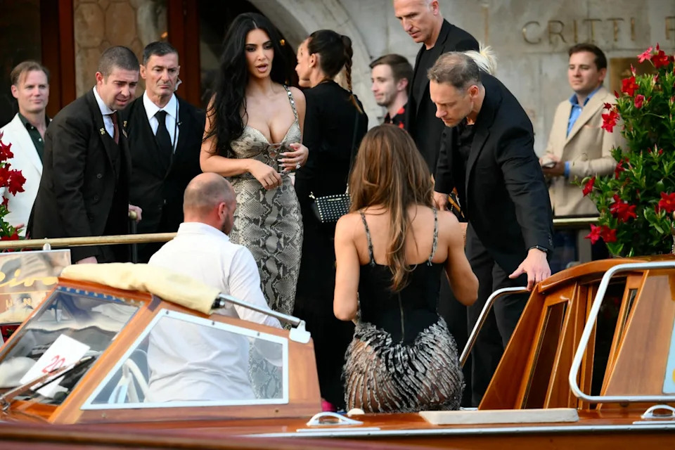 The Good American founder, who completed her look with a silver bracelet and black sunglasses, traveled in the water taxi on Thursday with her sister, Kim Kardashian (AFP via Getty Images)