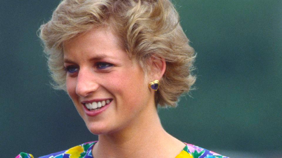 Princess Diana pictured wearing the floral Bellville Sassoon gown, which is estimated to fetch up to $300,000, to a polo match in 1988. - Tim Graham/Getty Images
