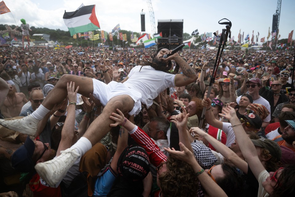 Bobby Vylan of British duo Bob Vylan crowd surfing at Glastonbury Festival.