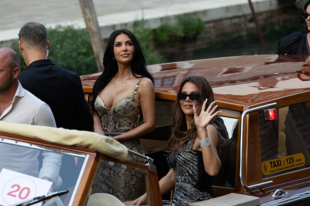 Kris Jenner takes a picture of Khloe Kardashian and Kim Kardashian at the pre wedding event of Jeff Bezos and Lauren Sanchez in Venice, Italy
