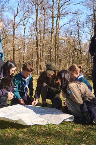 Kensington Palace Princess Kate looks over a map with, from right to left) Esmee Chan (from 1st Buddha Light Explorer Scouts, Stretford, Greater Manchester), Kurt Lindhofer (from 1st Ulverston Scouts), Erika Rawlinson (from 1st Ulverston Scouts), Yuxun Choy (from 1st Buddha Light Explorer Scouts, Stretford, Greater Manchester)