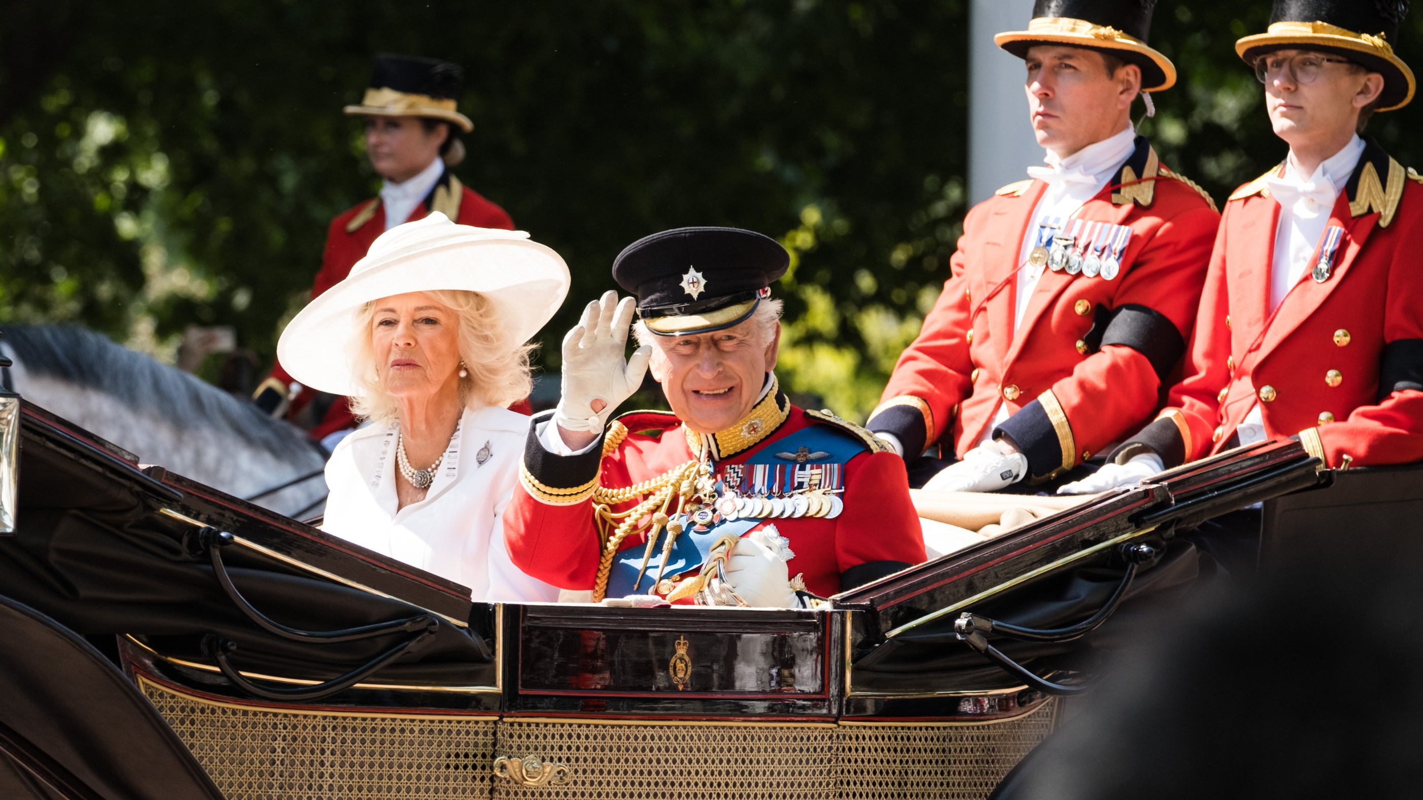 King Charles III and Queen Camilla ride in the royal carriage on The Mall at Trooping the Colour 2025