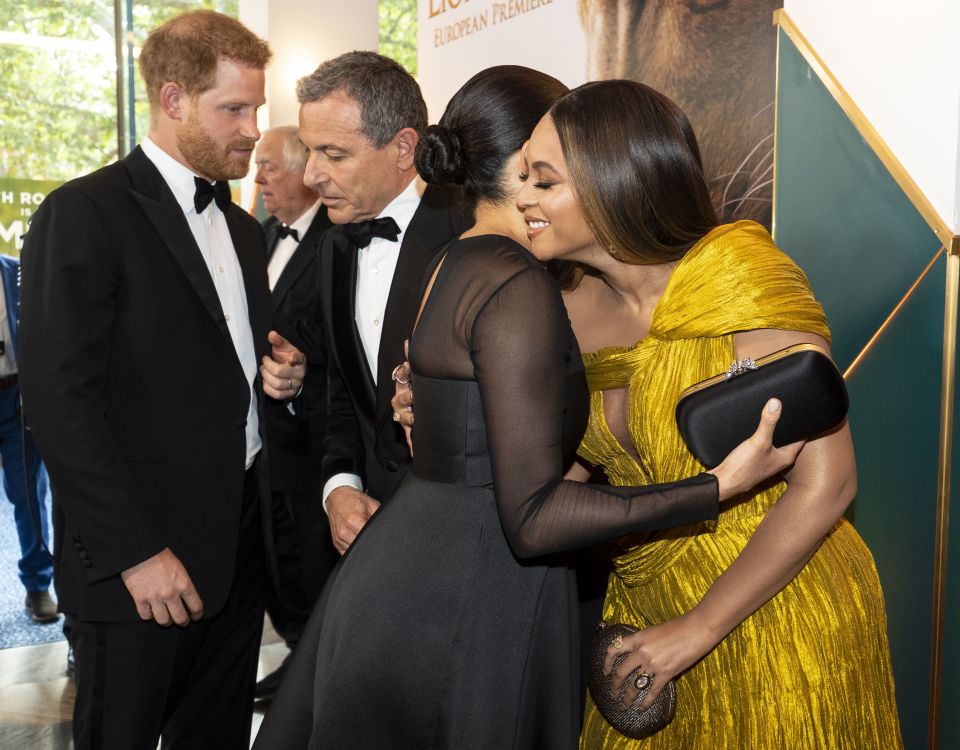Meghan Markle embracing Beyoncé at the European premiere of Disney's The Lion King.