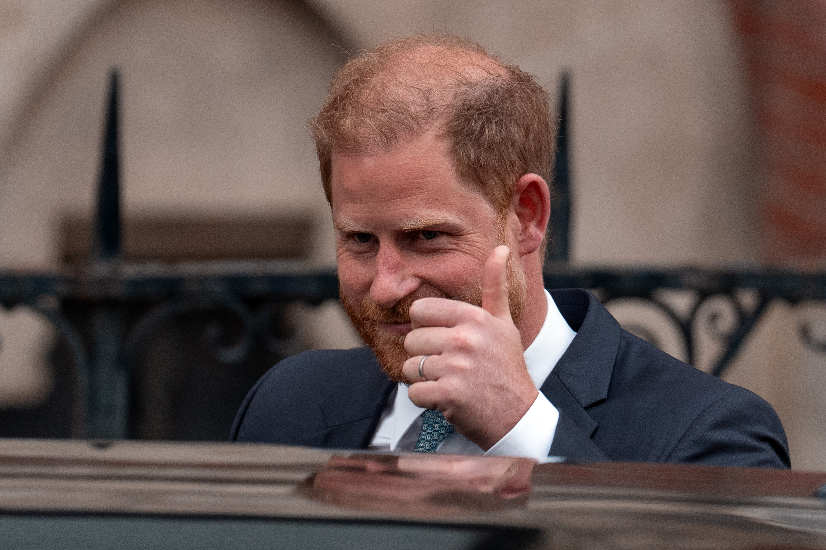 Prince Harry giving a thumbs up outside court on April 8, 2025