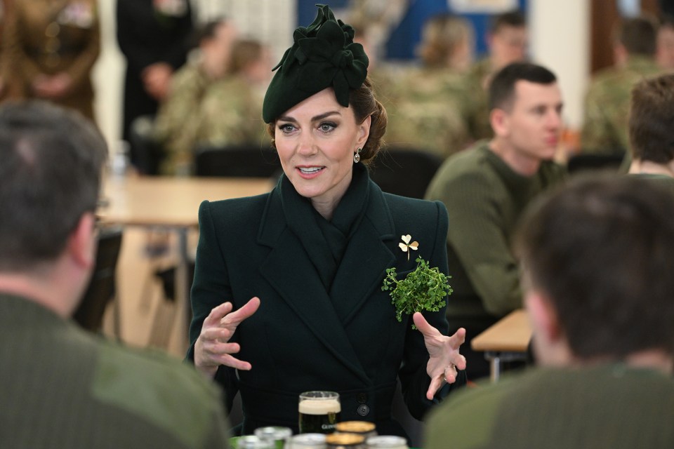 The Princess of Wales speaks with Irish Guardsmen and their families at a St. Patrick's Day event.