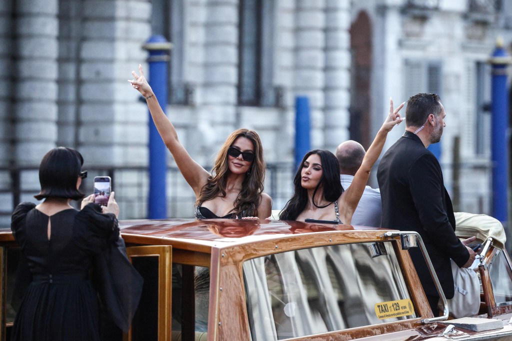 Kris Jenner takes a picture of Khloe Kardashian and Kim Kardashian at the pre wedding event of Jeff Bezos and Lauren Sanchez in Venice, Italy