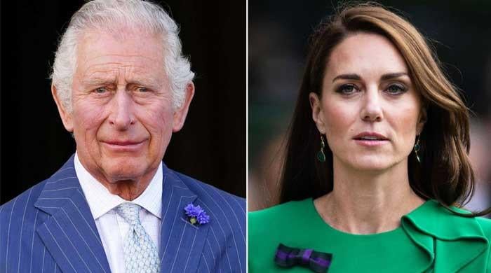 King Charles beams as he talks to Kate Middleton's mother