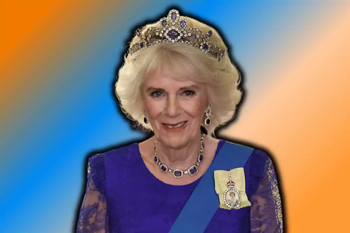 A woman wearing a tiara and blue dress smiles in front of a gradient background of orange and blue colors. A woman wearing a tiara and blue dress smiles in front of a gradient background of orange and blue colors.