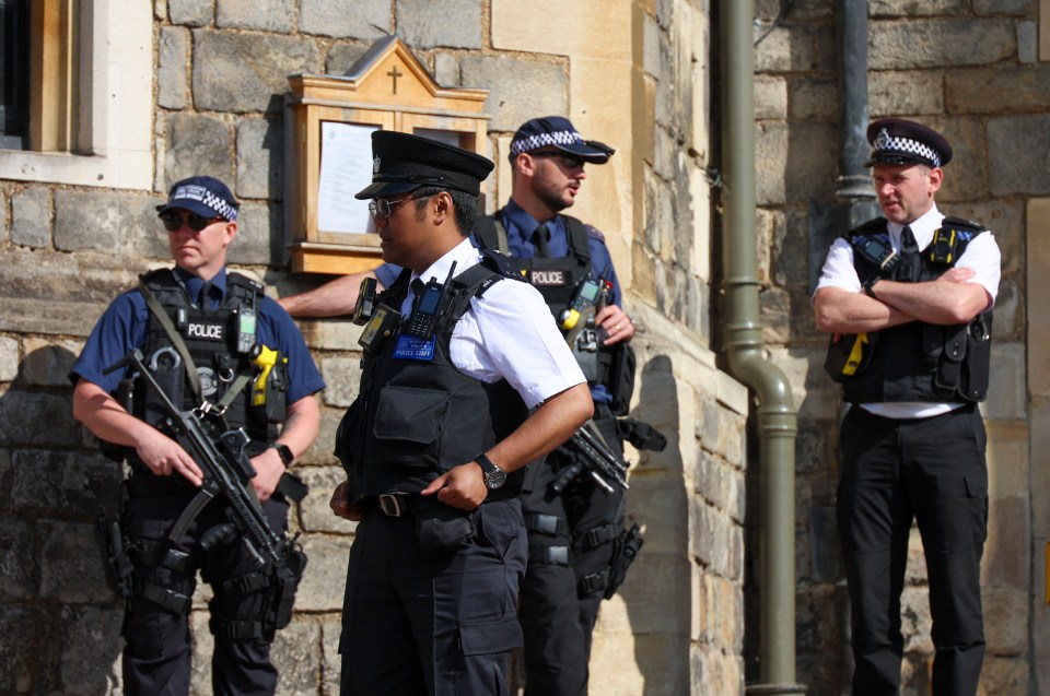 Police officers standing guard at Windsor Castle.