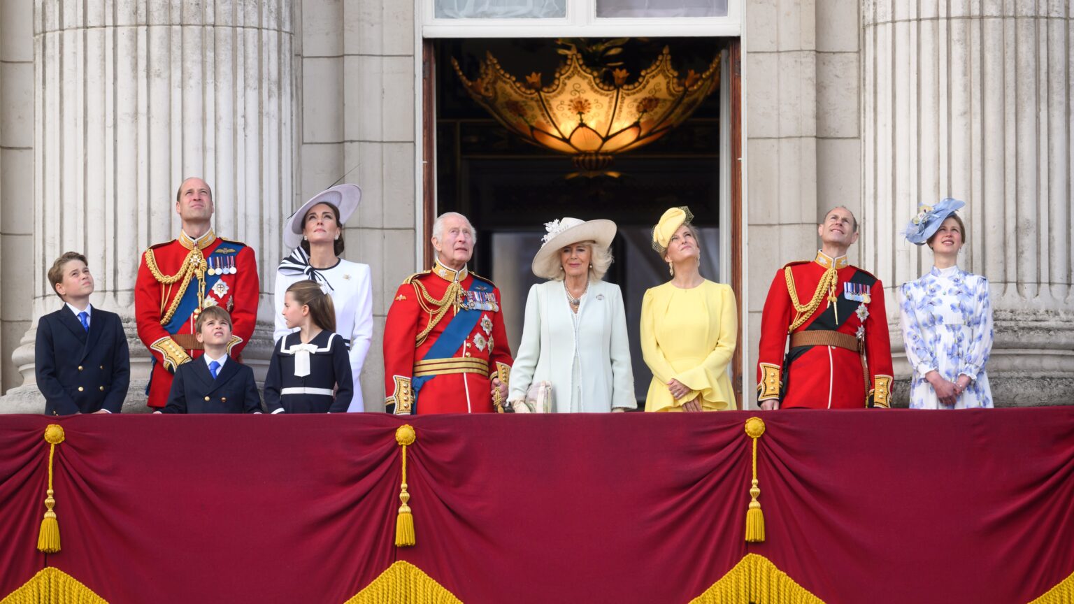 What does Trooping the Colour mean, what is this annual royal event and what time does it start? Members of the Royal Family stand on the Buckingham Palace balcony to watch the flypast during Trooping the Colour 2024