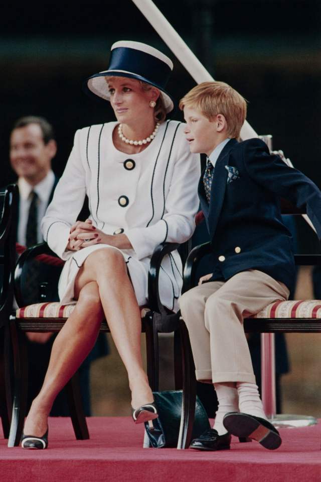 Princess Diana and her son Harry watching a march past.