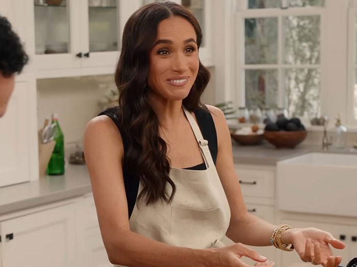 Meghan Markle in a kitchen setting sharing her cooking hack, facing criticism for the kitchen hack she revealed. Meghan Markle in a kitchen setting sharing her cooking hack, facing criticism for the kitchen hack she revealed.