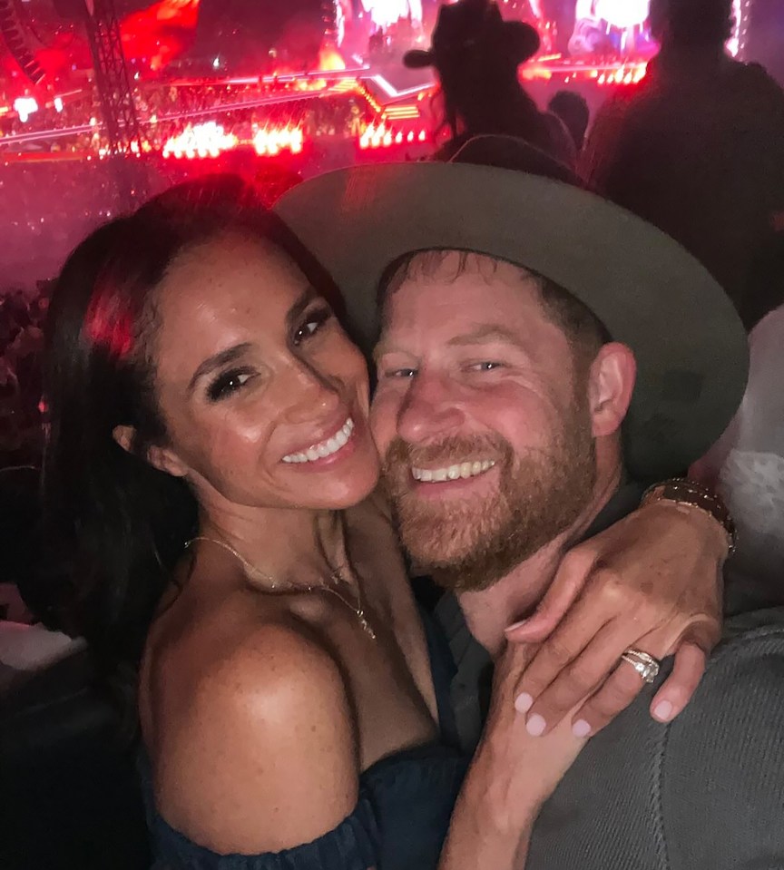 Meghan Markle and a man at a Beyoncé concert.