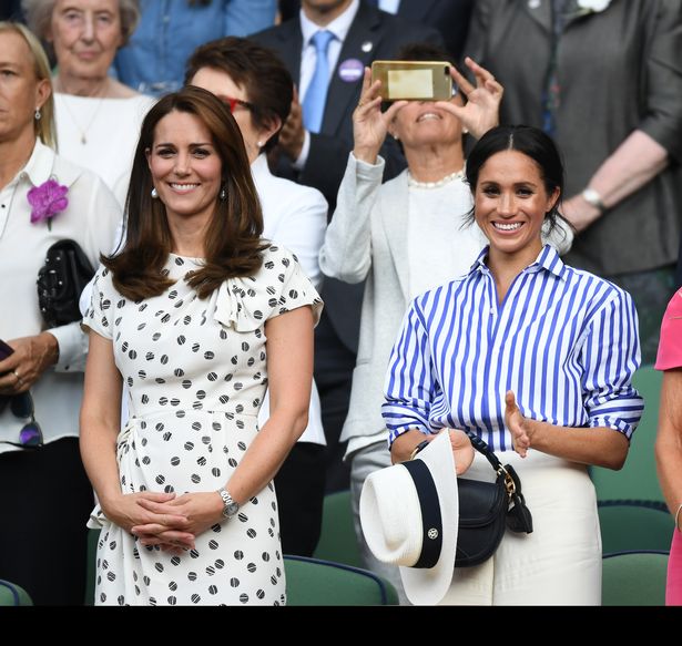 The pair smile as they watch from the Royal Box