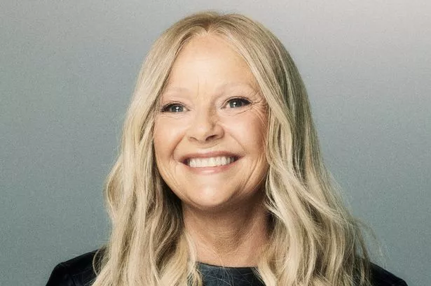 Gail porter with blonde wig smiling