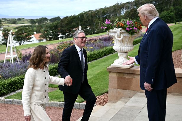 US President Donald Trump (R) greets Britain's Prime Minister Keir Starmer and his wife Victoria Starmer upon his arrival to attend a bilateral meeting at the Trump Turnberry Golf Courses, in Turnberry south west Scotland on July 28, 2025. (Photo by Brendan SMIALOWSKI / AFP) (Photo by BRENDAN SMIALOWSKI/AFP via Getty Images)          