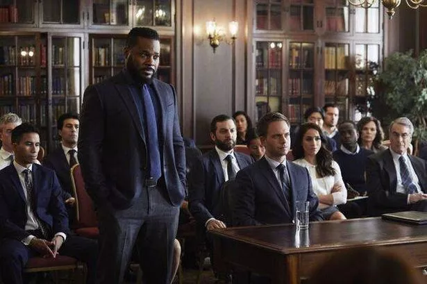 Malcolm-Jamal Warner and Meghan Markle in Suits