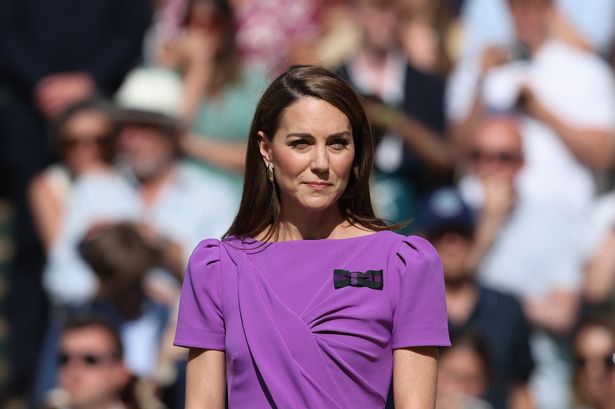 Kate on day 14 of Wimbledon 2024 with a serious expression wearing a purple dress