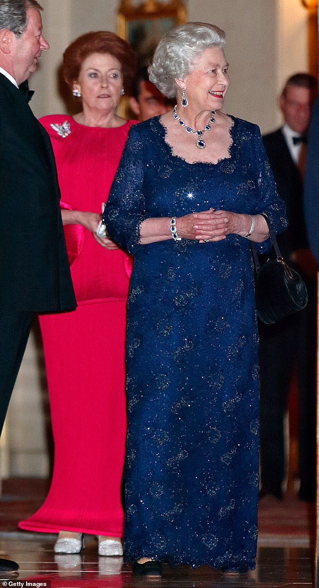 Lady Anson, pictured with Queen Elizabeth II, was not convinced that Meghan was in love with Harry and warned that she 'could turn into nothing but trouble'