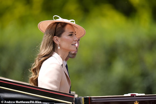 The Princess of Wales, pictured, was the image of glamour during the carriage procession to Windsor Castle this afternoon
