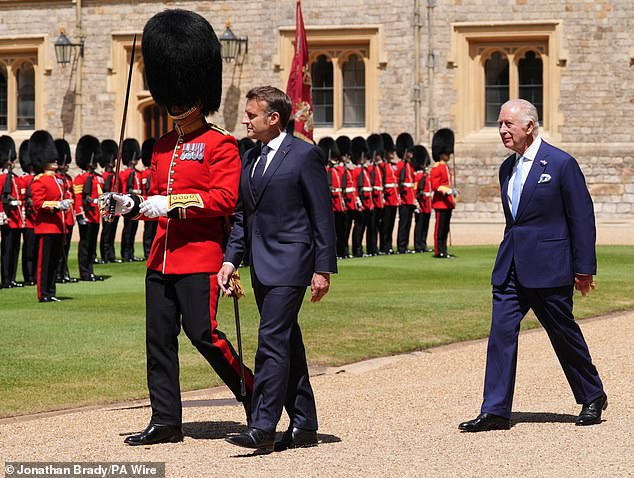 Emmanuel Macron and King Charles both pictured inspecting the Guard of Honour at Windsor Castle today