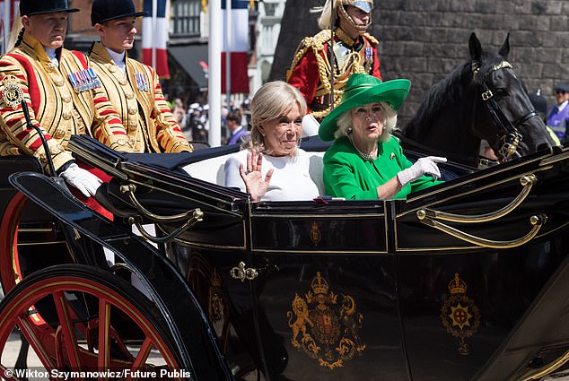 Brigitte Macron and Queen Camilla seen travelling in a Semi-State Landau through Windsor today