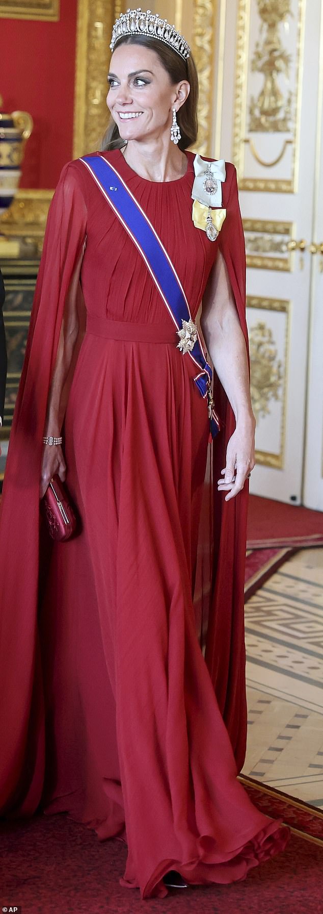 The Princess of Wales dazzled in deep crimson this evening as she stepped out for the State Banquet held in honour of French President Emmanuel Macron