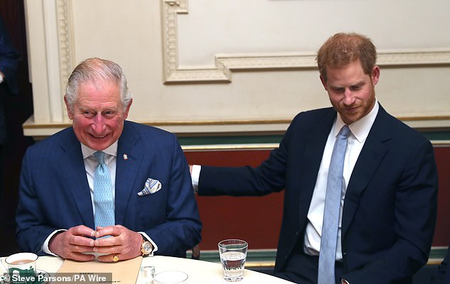 The monarch and his youngest son, Prince Harry, are pictured together in December 2018